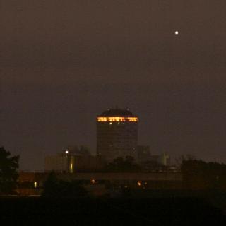 Venus rising at dawn behind a city centre tower block (Copyright Martin J Powell, 2011)